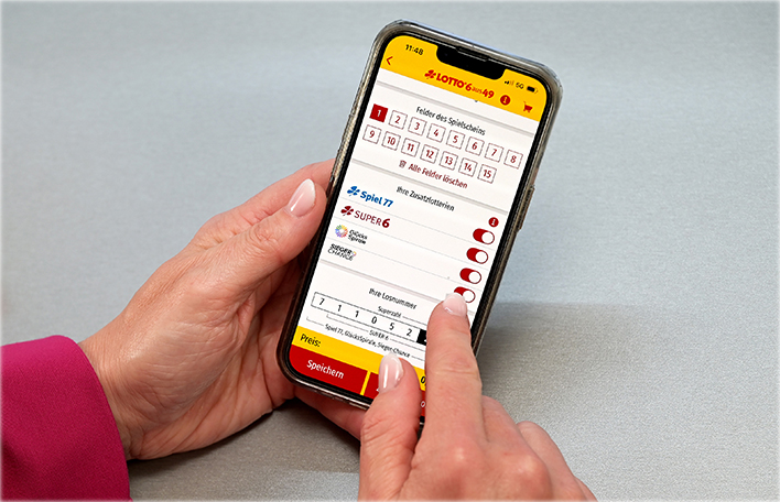 Spielschein von LOTTO 6aus49 mit angekreuzten Zusatzlotterien auf dem Handy. Foto: SLSV